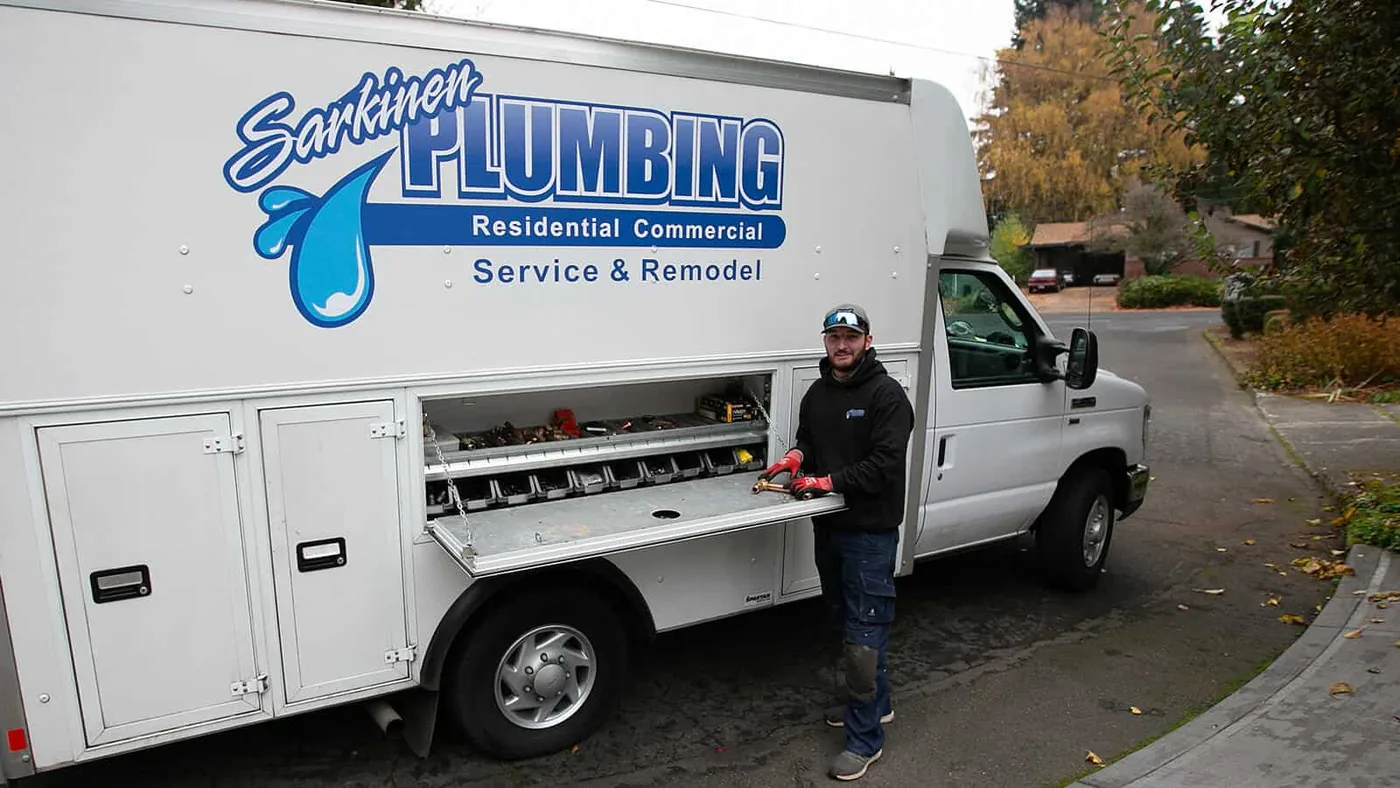 Sarkinen Plumbing technician at the company’s branded service truck, from the Sarkinen website